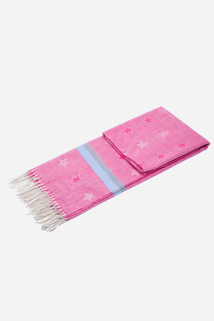 laying flat and folded to show the star print, stripes and tassel trim edge