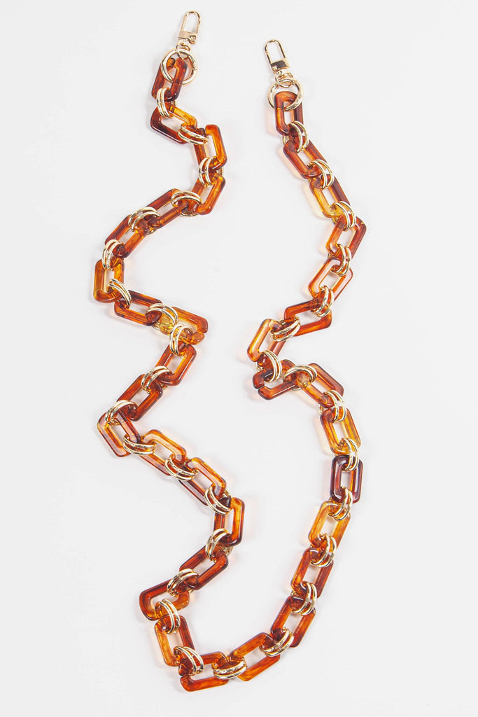 brown and gold acrylic bag strap