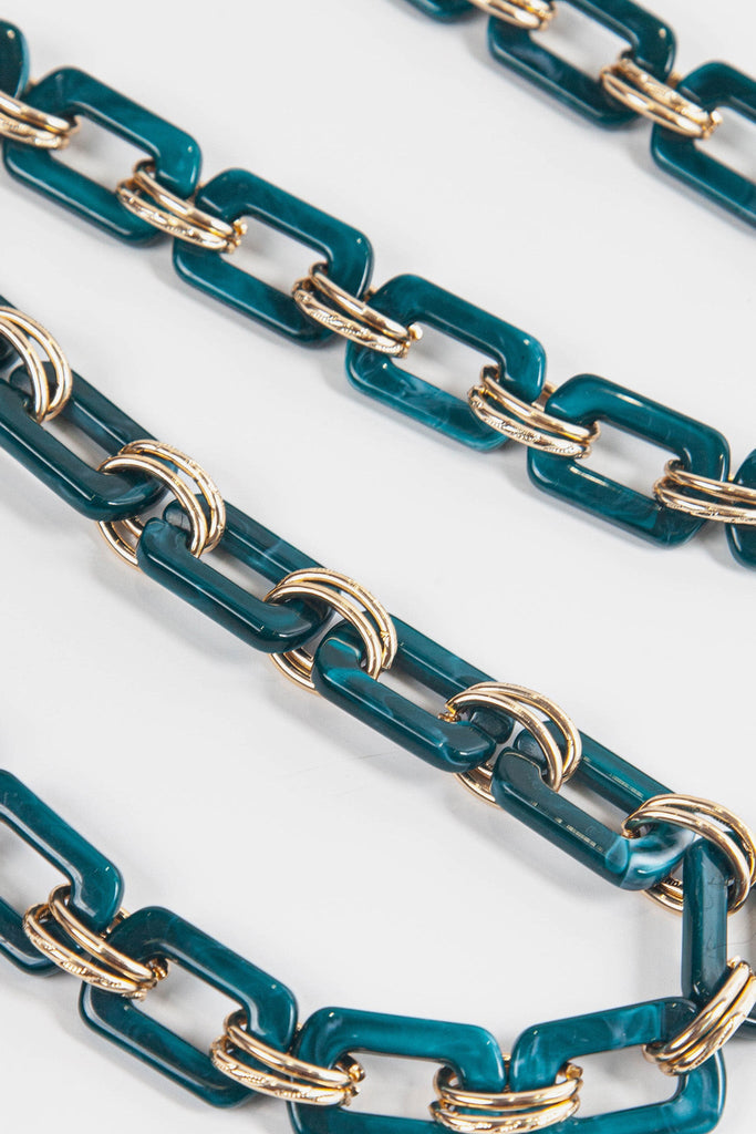 teal square link acrylic bag strap with gold attachments