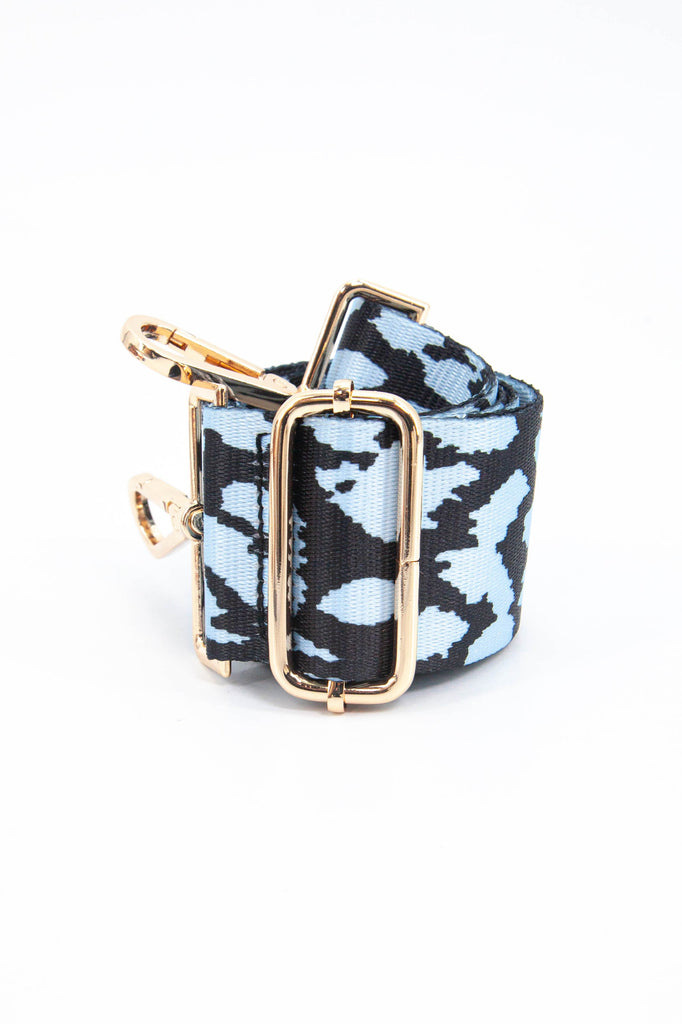 close up of the two tone blue animal print bag strap