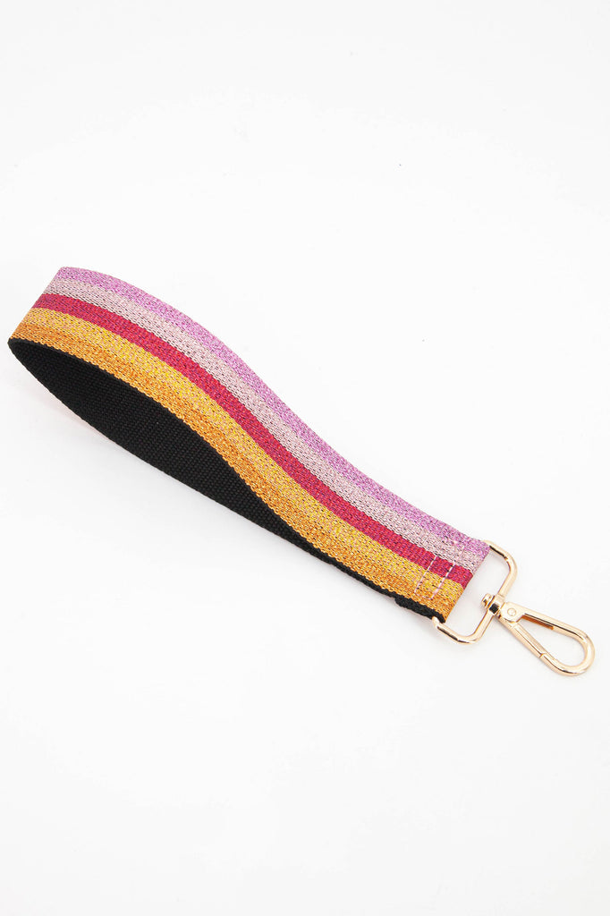 pink, red and orange glitter striped clip on wristlet bag strap with gold snap hook attachment