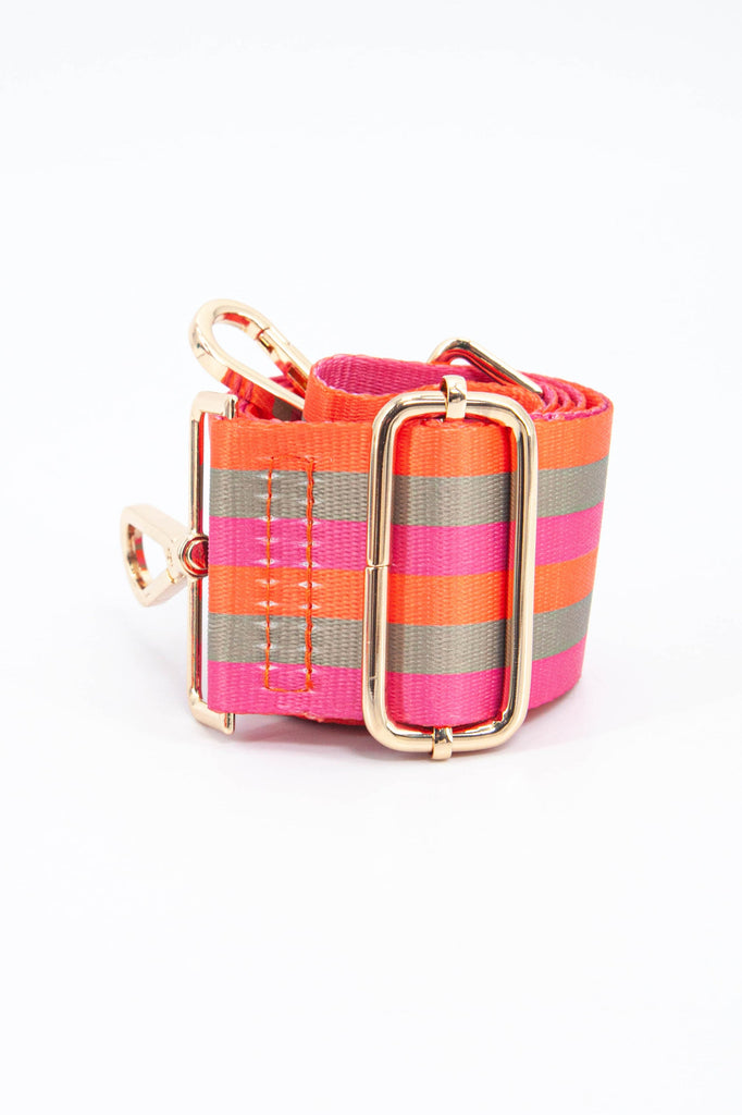 close up of the gold adjustment buckle and the pink, orange and khaki green striped pattern