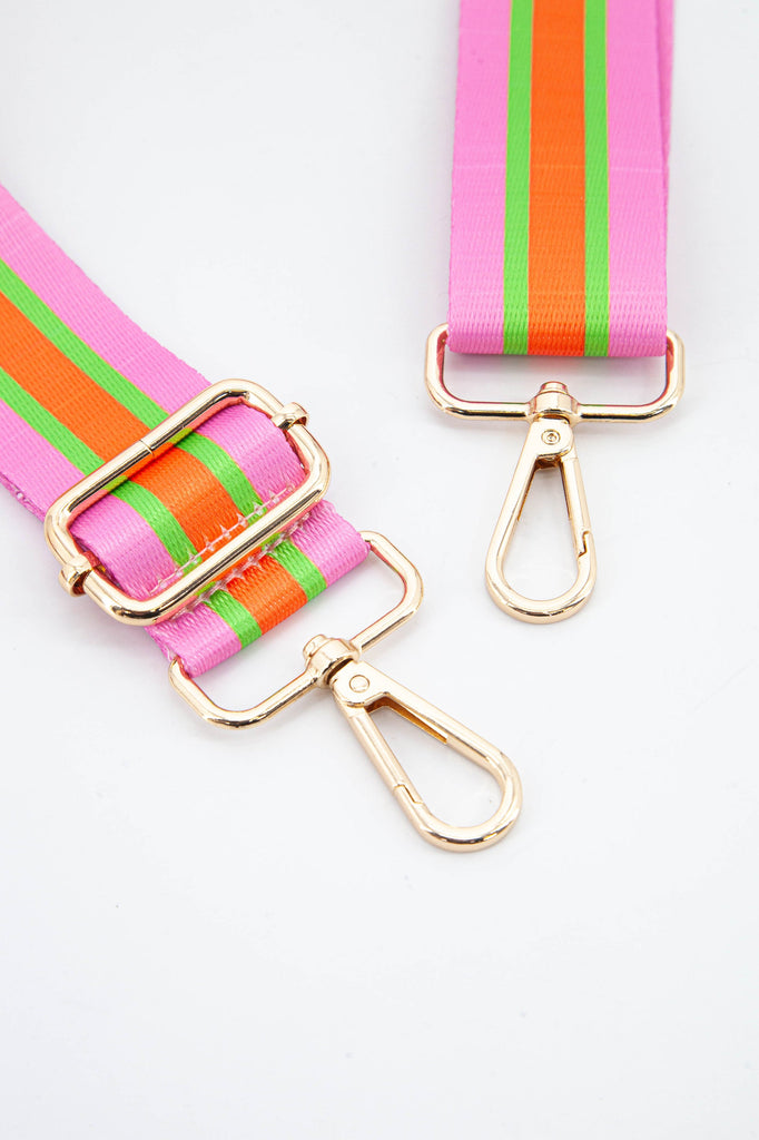 close up of the gold snap hook clip on attachments 