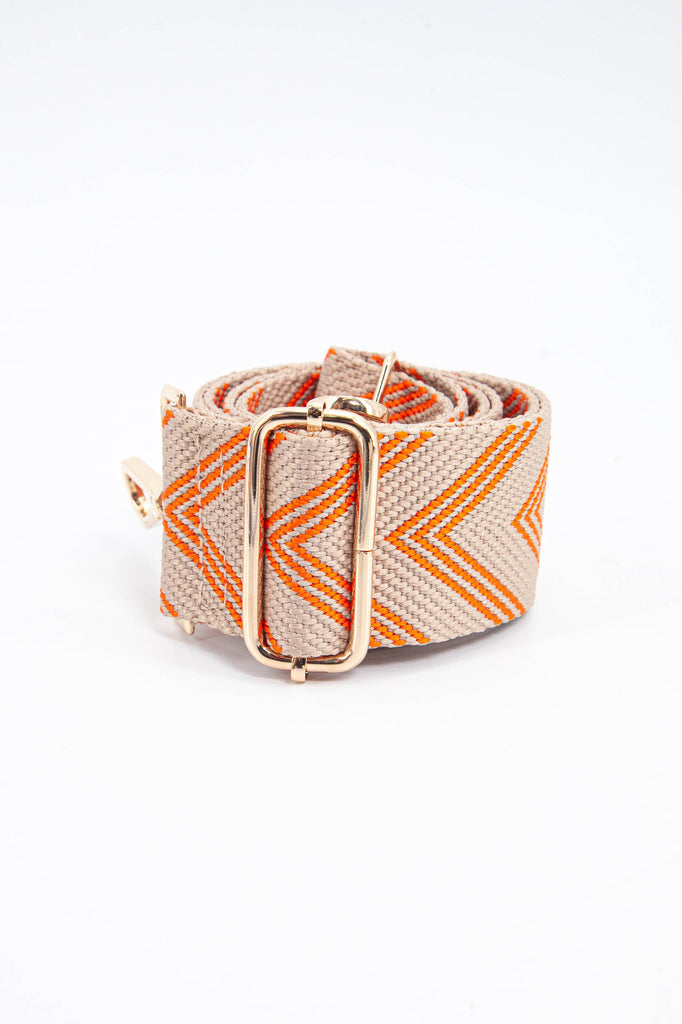 close up of the orange chevron pattern and gold adjustment buckle