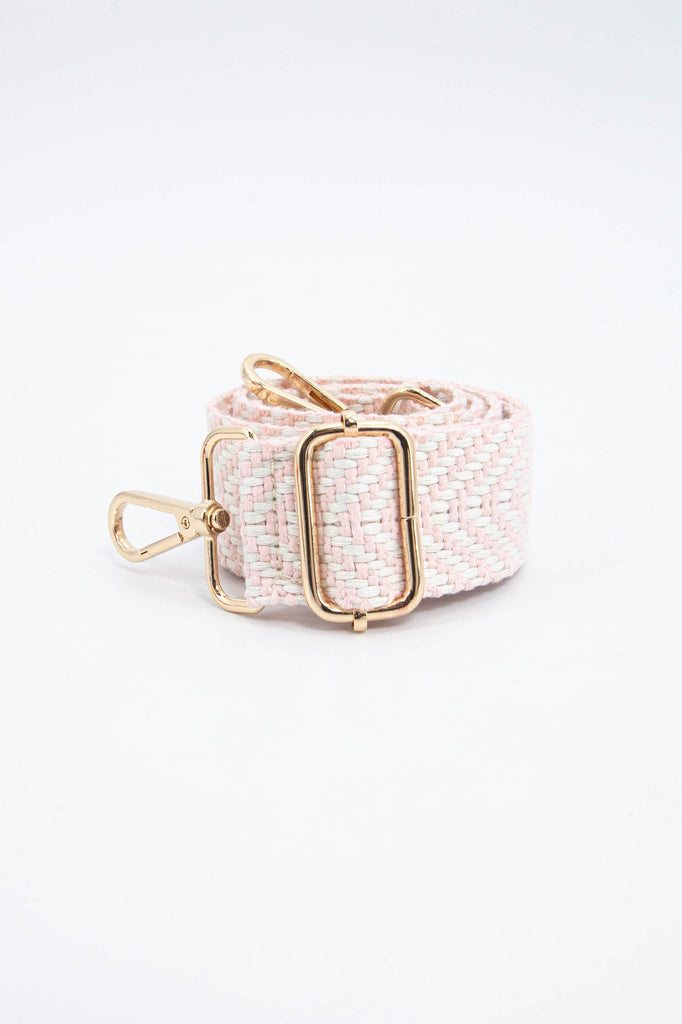 close up of the woven fabric and gold adjustable buckle