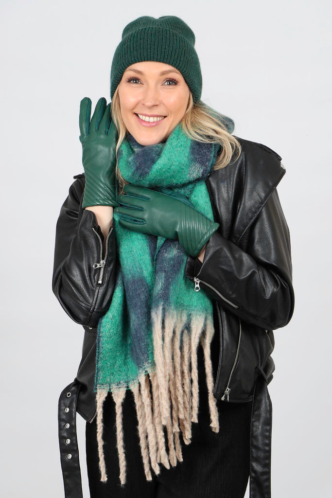 model wearting green leoaprd print blanket scarf with green hat and gloves
