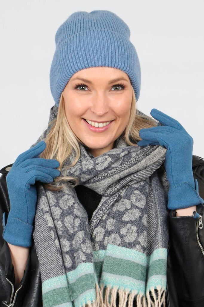 model wearing a plain light blue beanie hat