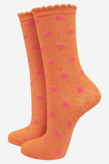 orange glitter ankle socks with an all over pink star pattern and scalloped cuffs
