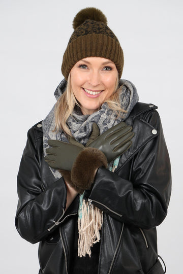 model wearing a khaki green animal print beanie hat with pom pom