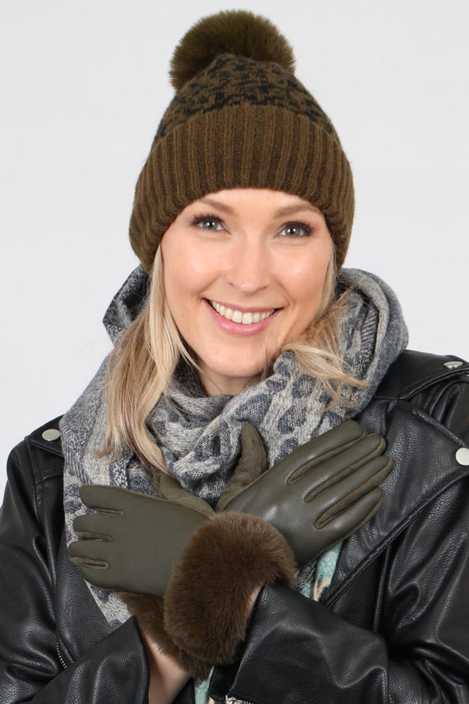 model wearing khaki green faux leather gloves with a faux fur trim around the wrist
