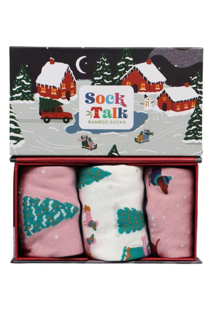 an artistic gift box designed to look like a winter village with three pairs of womens bamboo socks