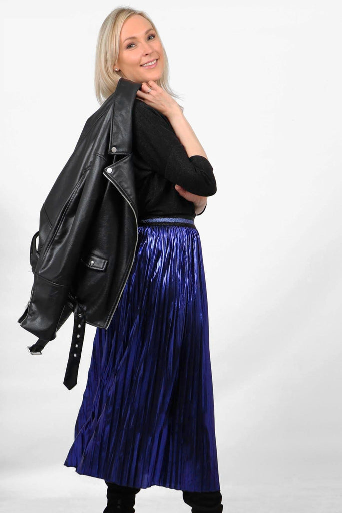 model wearing a blue metallic foil midi skirt with a blue glitter stripe elasticated waist band