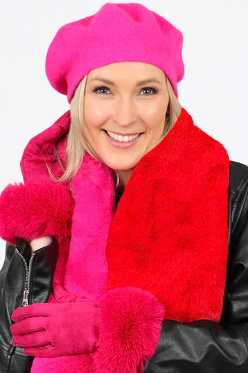 model wearing fuchsia pink faux velvet fur trim gloves and matching pink accessories