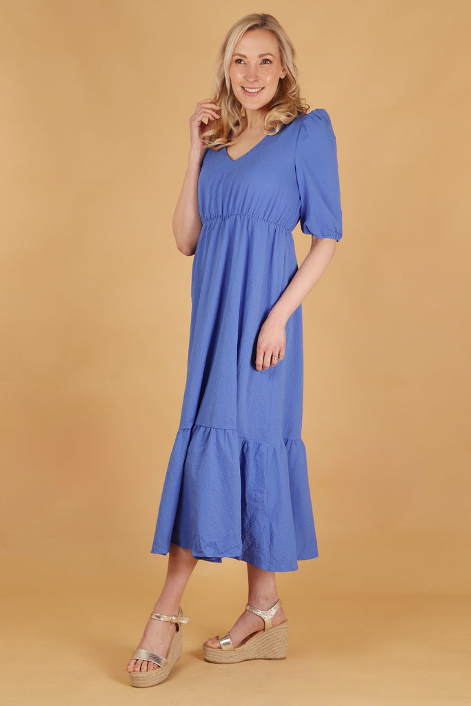 plain blue v neck midaxi fress with tiered hem and elbow length puff sleeves